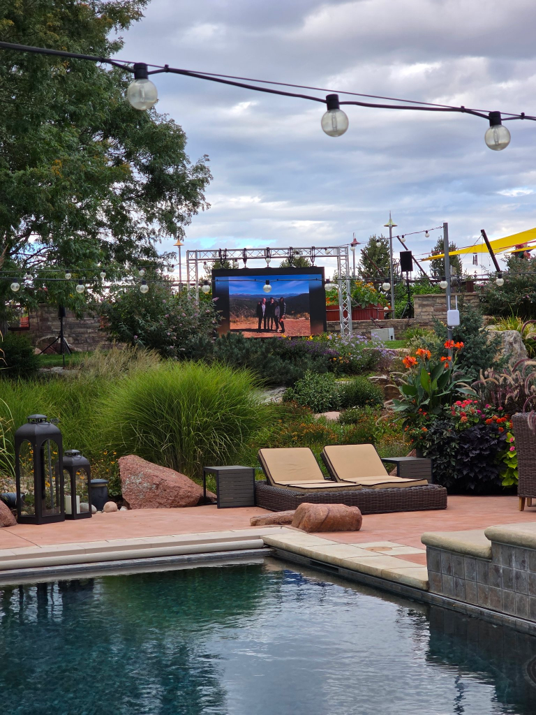 LED video wall with live event visuals at a poolside party