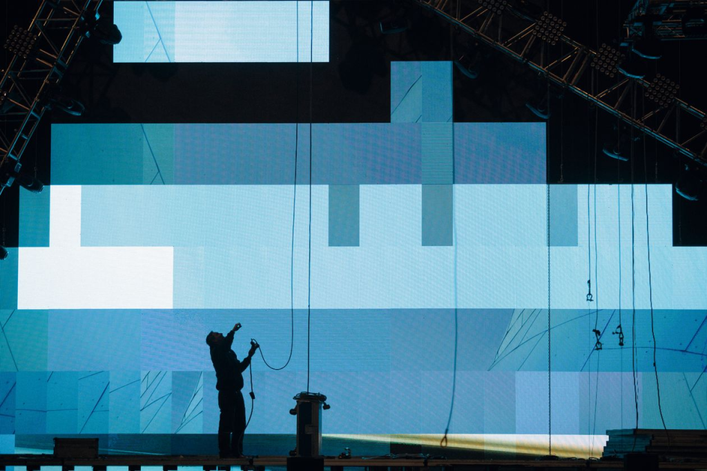 VIBE technician assembling an LED video wall at an event