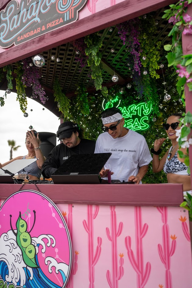 DJ booth with crew at Party Peas outdoor event