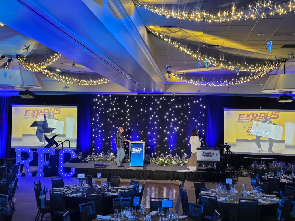 Gala with RFC marquee letters and starlight drape backdrop