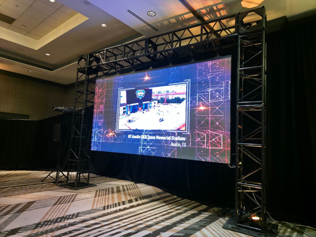 LED wall on truss showing UT Austin stadium content