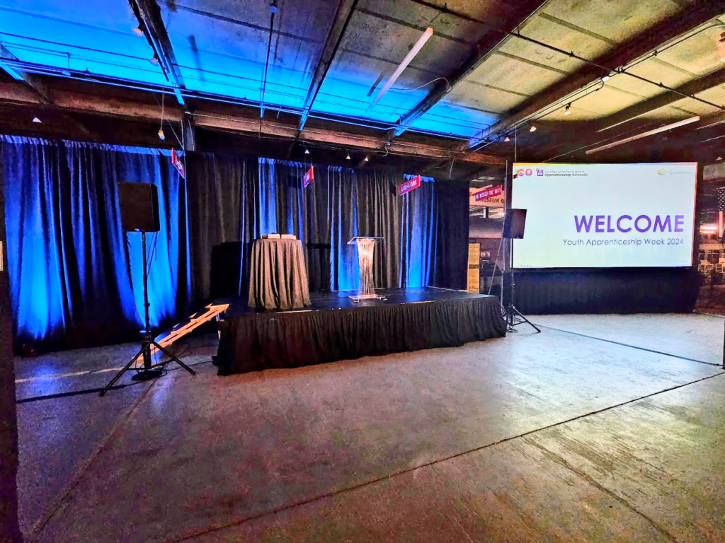 Youth Apprenticeship Week 2024 welcome stage with drape and podium